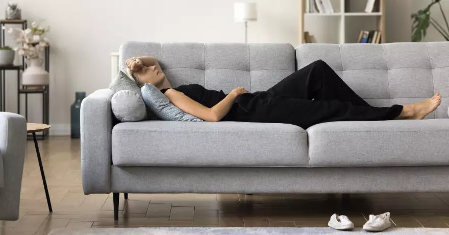 woman laying on couch